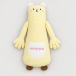 Yellow bear soothing patting Yorkie pillow